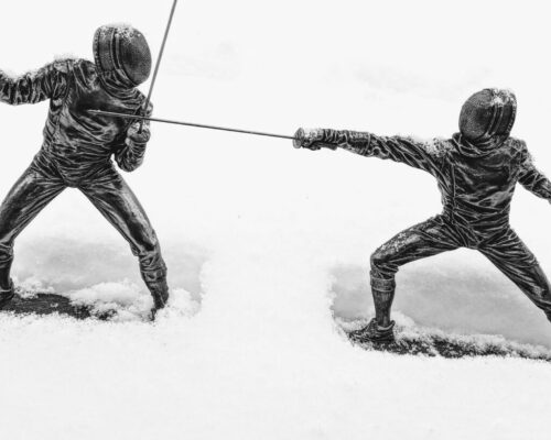 metal fencer statue snow inclement weather