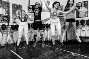girls jumping fencing 2